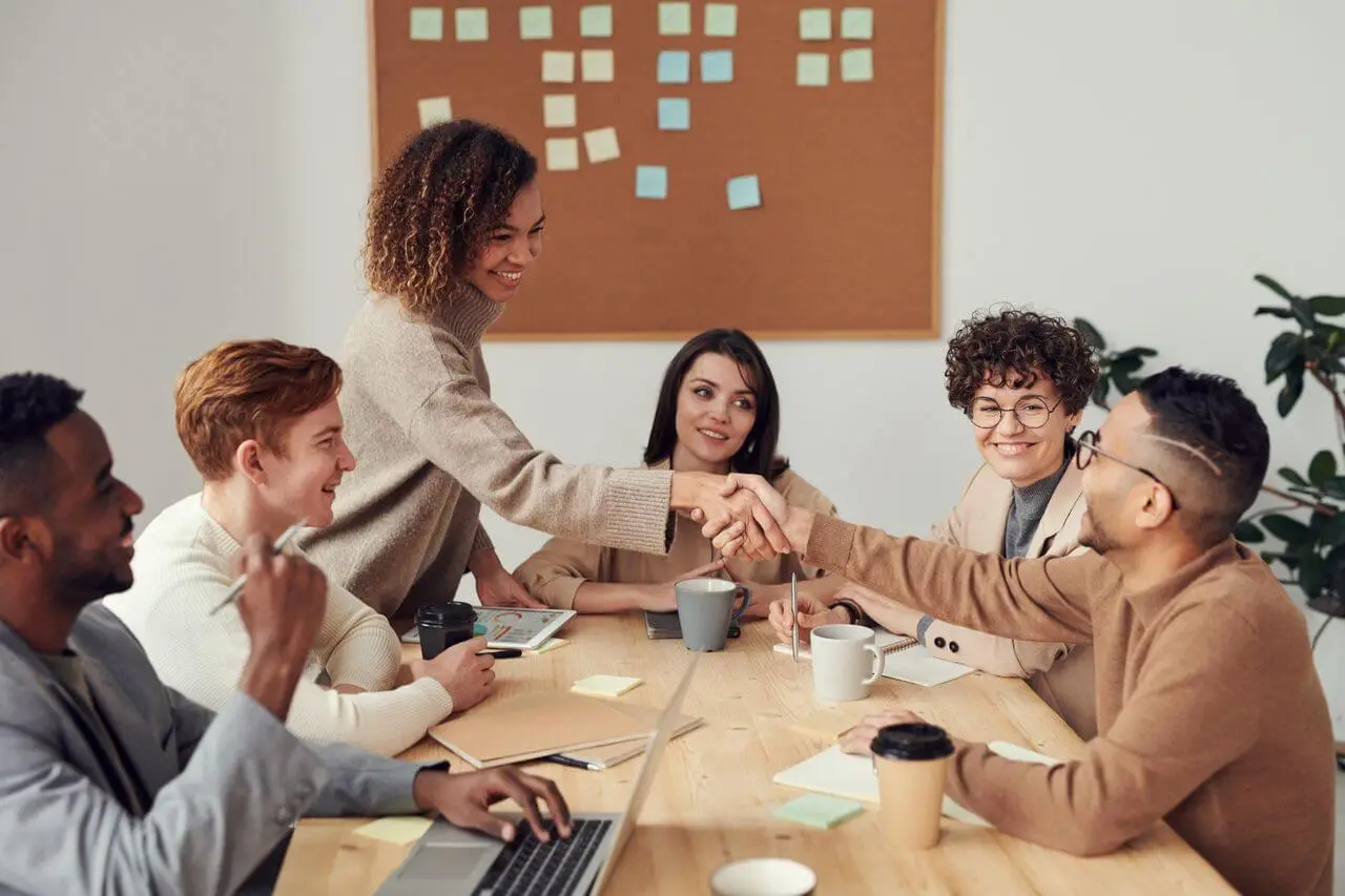 Work-team-collaborating-in-meeting-showcasing teamwork-and-cooperation-in-a-modern-workplace