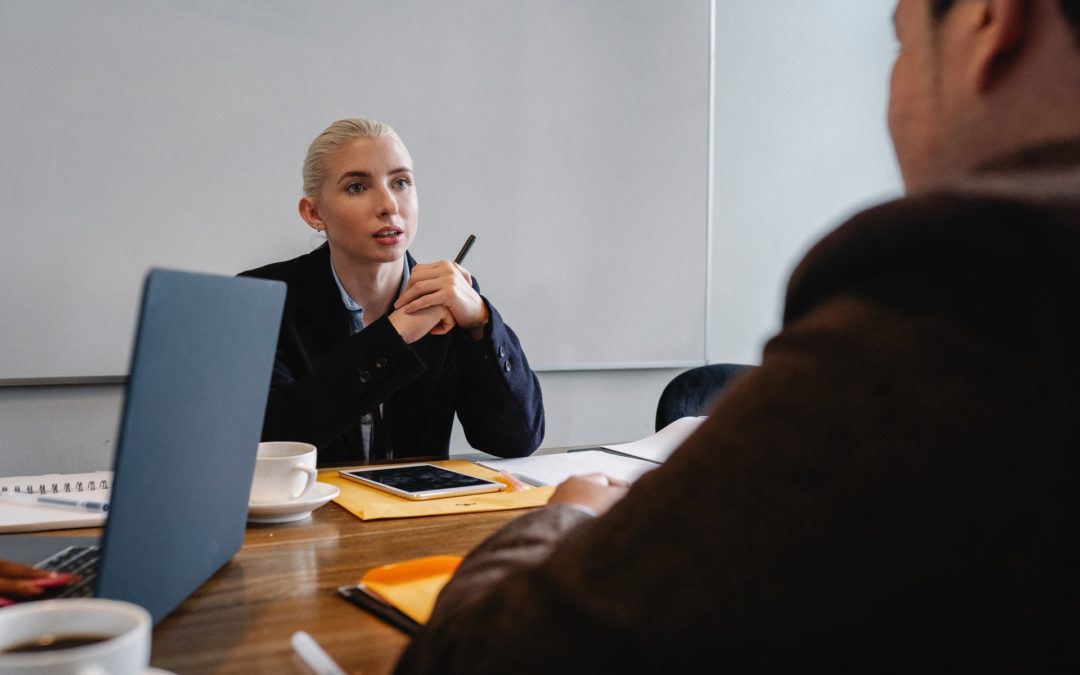 Woman manager discussing performance review phrases win meeting