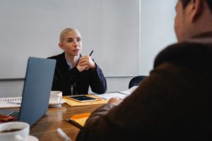 Woman manager discussing performance review phrases win meeting