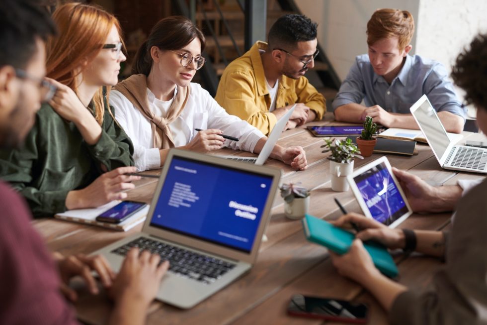 Group of several people reviewing a project