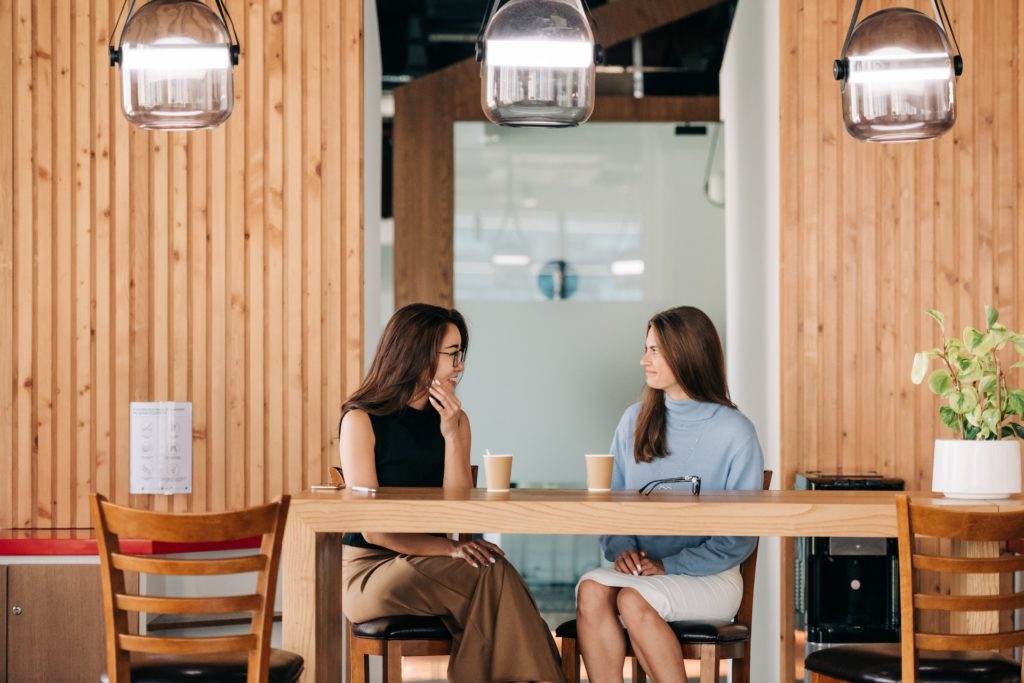 Woman providing feedback to her manager during a performance review