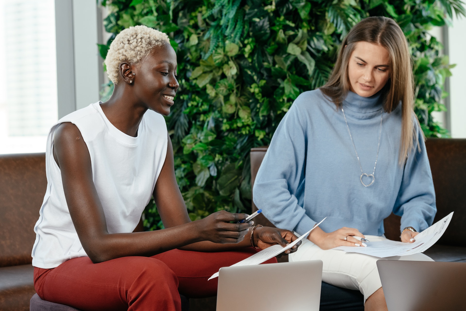 Two women reviewing career development plan