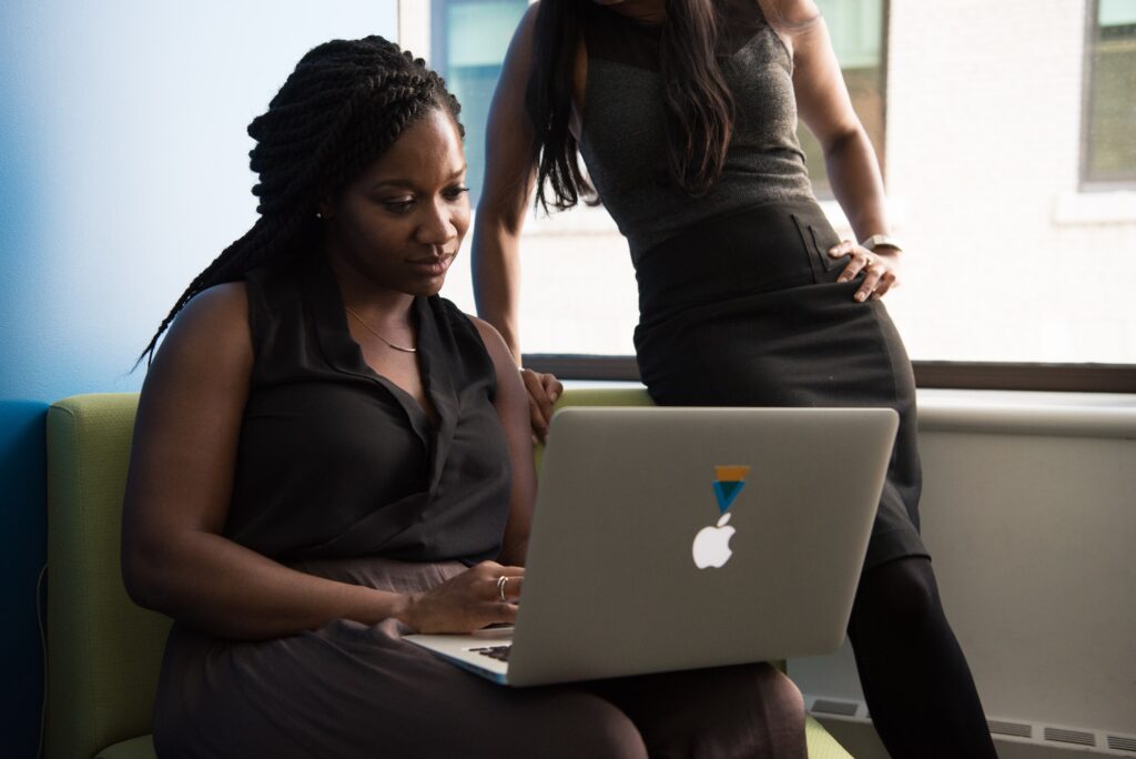 Black woman using MacBook to complete leadership grid