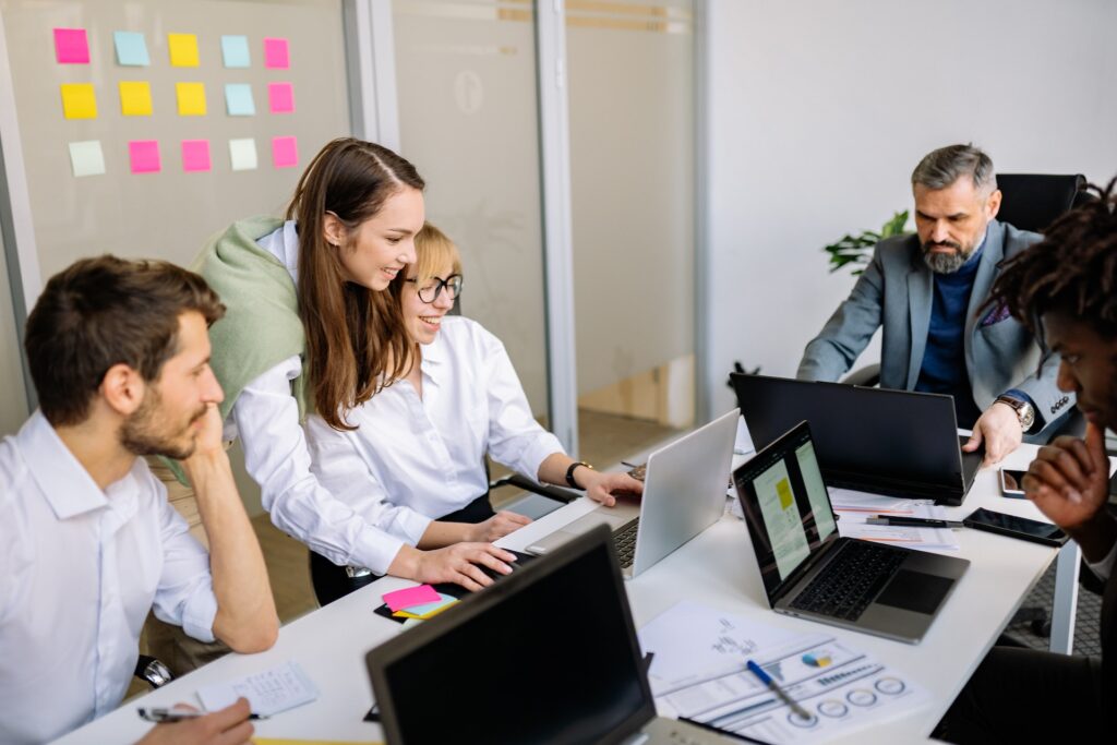 Group of managers discussing people strategy in office setting