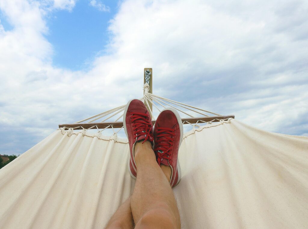 A person relaxing in a hammock on vacation