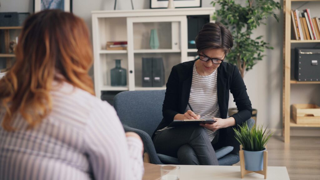 Manager going over one-on-one questions with employee 