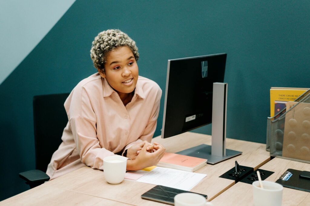 Woman sitting at her computer developing different career paths