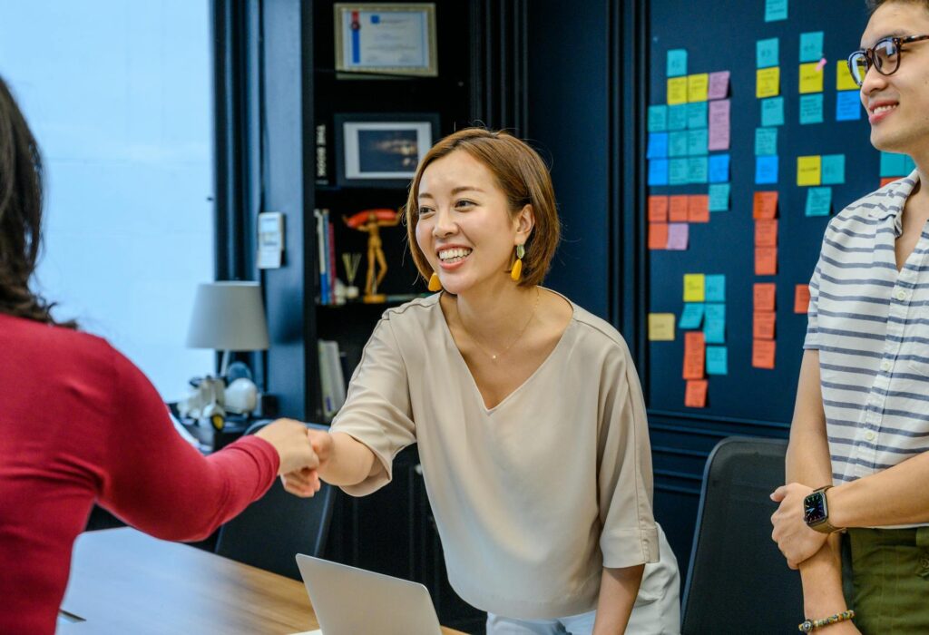 two female colleagues agreeing to use AI tools for performance management