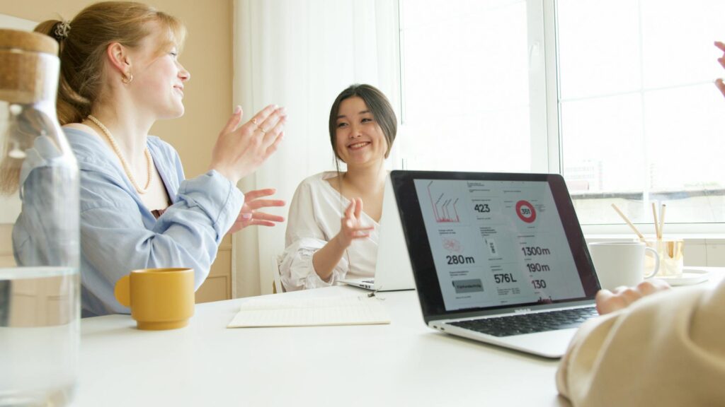 Female worker sharing praise to her colleague