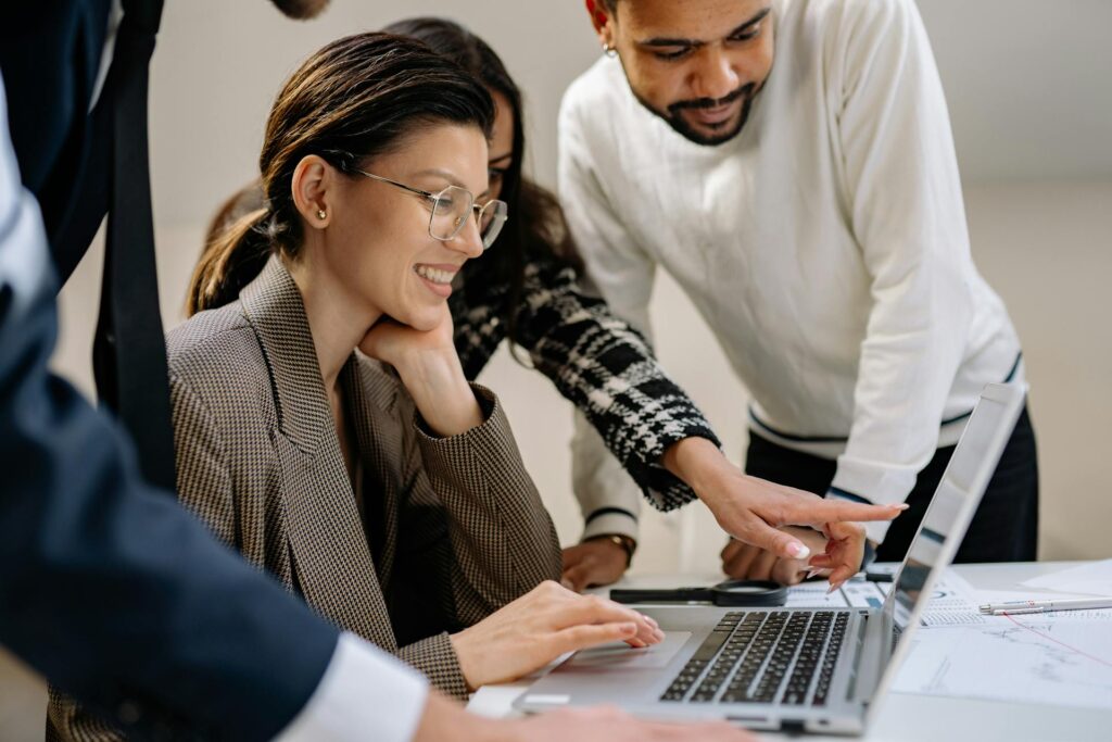 work team looking at their stretch goals online