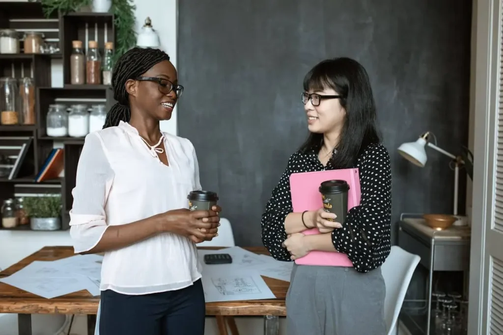 Two women talking about their performance appraisal results