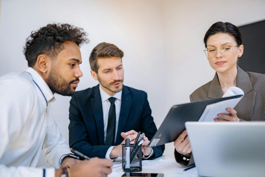 HR team looking over pros and cons of the compressed workweek